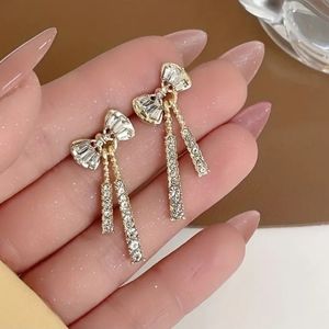Bowknot CZ drop earrings (silver plated)